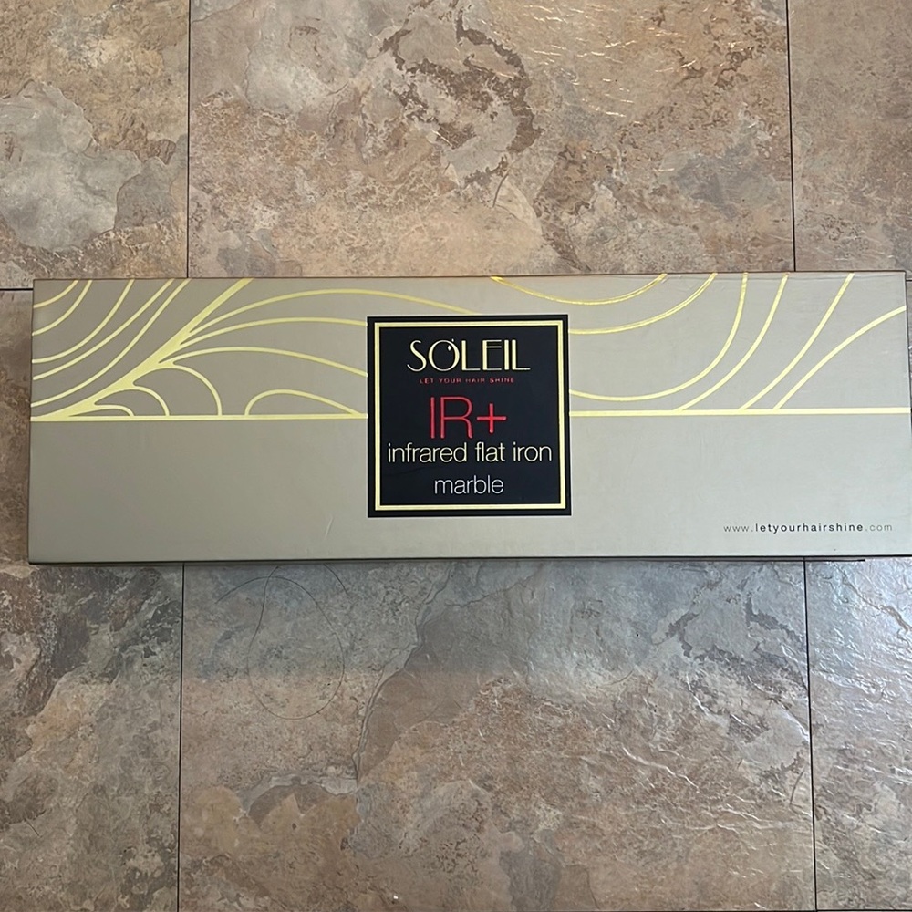 Brand new marble Soleil flat iron. Never used never taken out of the box.